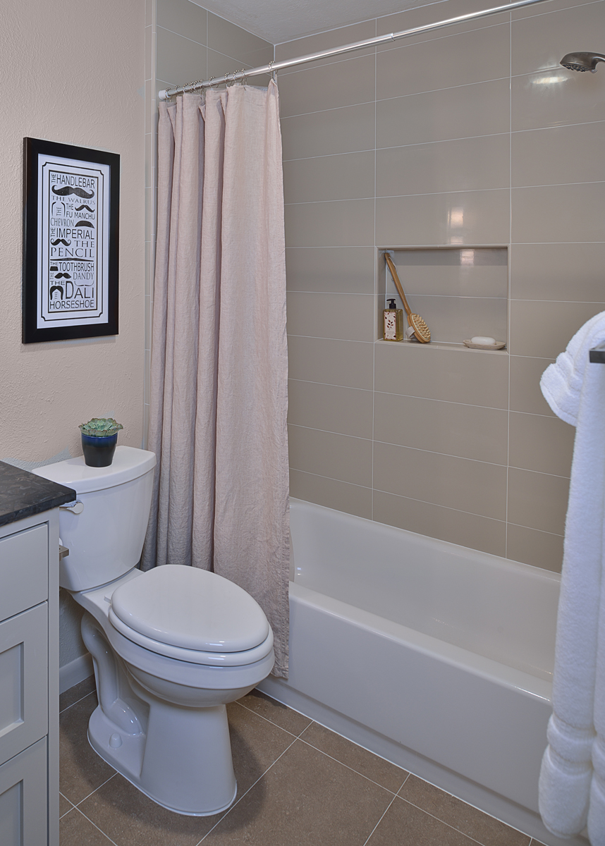 SEE THE FULL REMODEL: Before & After: A Bachelor's Dated Bathroom Gets A Contemporary Refresh | Photographer: Miro Dvorscak