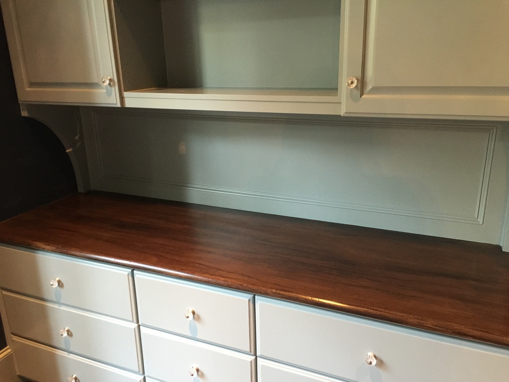 Faux finish wood top adds quality and upgrades the look of this built-in cabinet - done by Luis Altamirano of Transformations by Phyllis