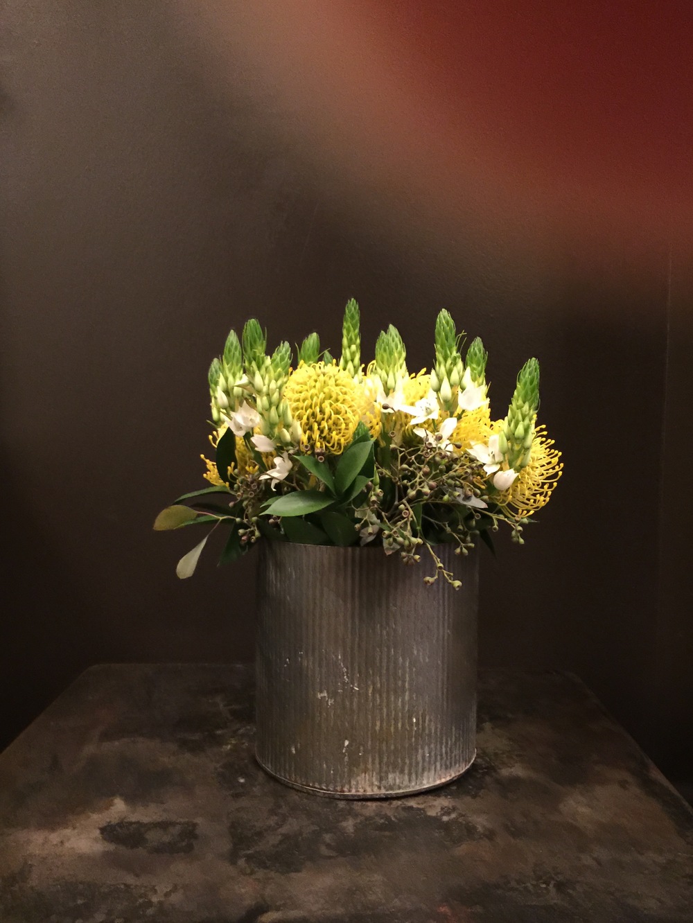 Fresh flowers in metal can - Hotel Emma