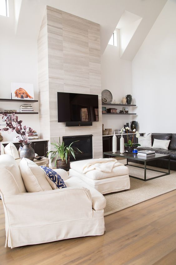Living room, tile on fireplace to ceiling | Interior Designer: Carla Aston