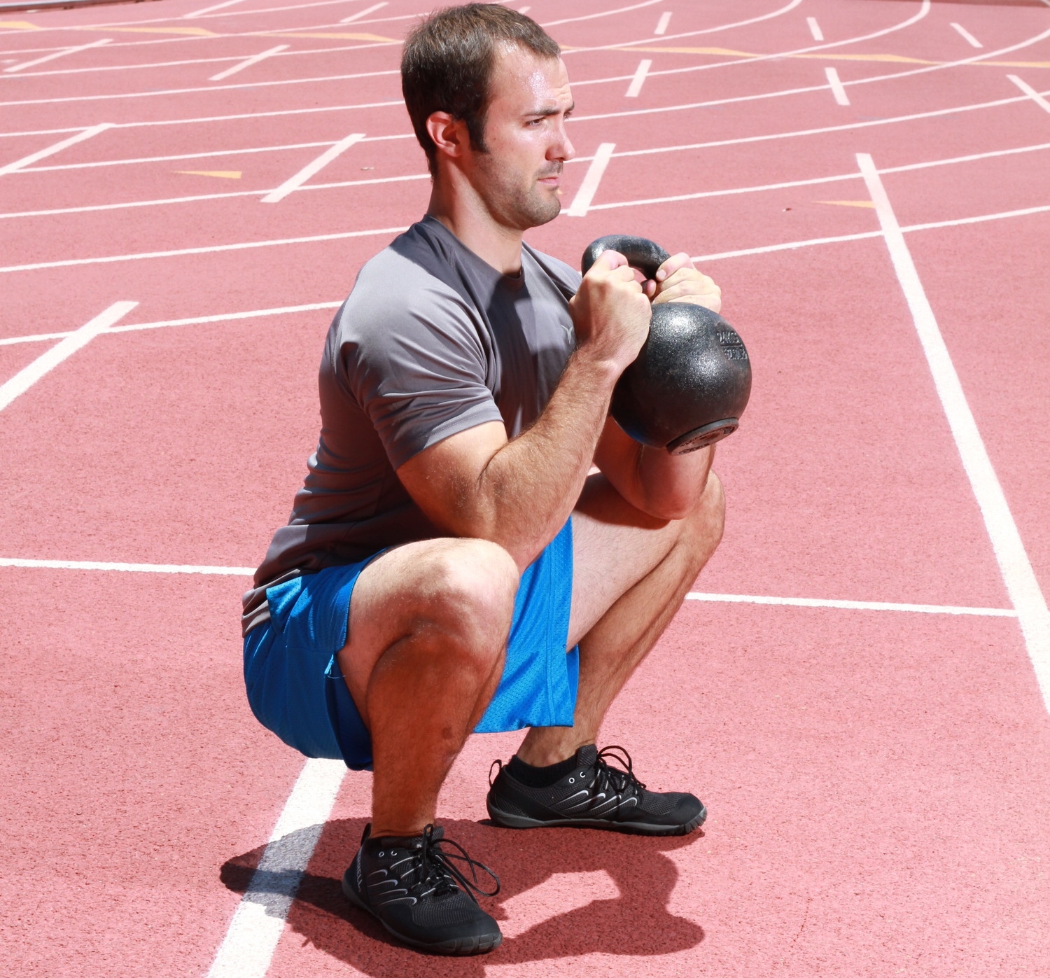 Personal trainer combining kettlebell goblet squats with a track workout in San Diego, CA. #deepsquatshappythoughts