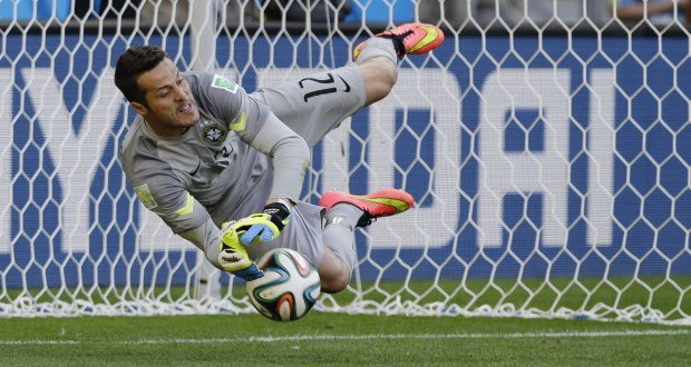 Brazil's goalkeeper Julio Cesar makes a save during a penalty shootout. image copyright: AP Photo/Ricardo Mazalan  