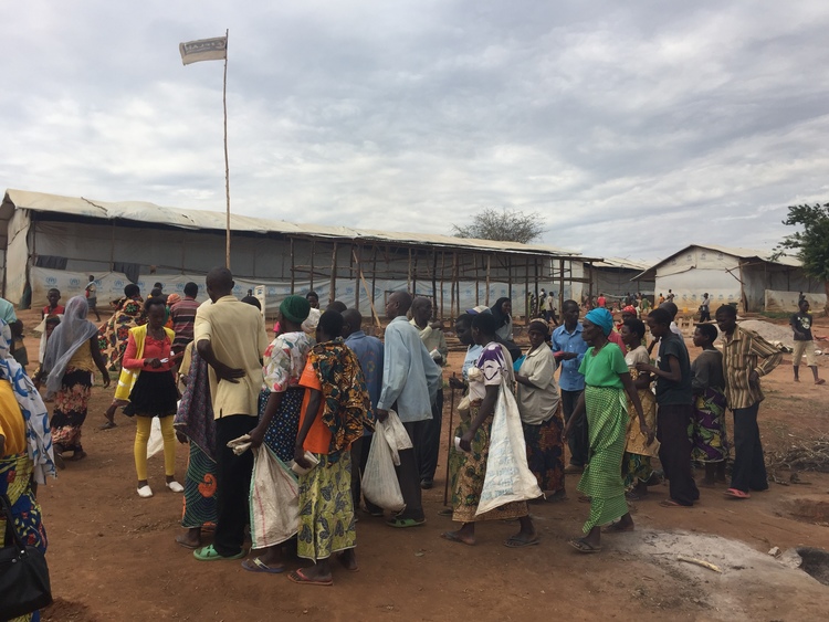 Burundian refugees line up for a distribution in Mahama camp, Rwanda. 