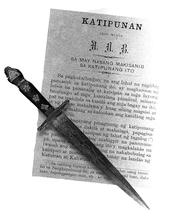 The tools used during the Katipunan's secret initiation rites: the Kartilya, the guidebook of the Katipunan, and the dagger used by new members to draw blood to sign their oath of allegiance. (Source: Felice Prudente Santa Maria's "Visions and Possibilities")