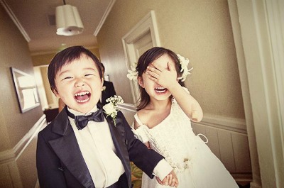 Happy little bride and groom
