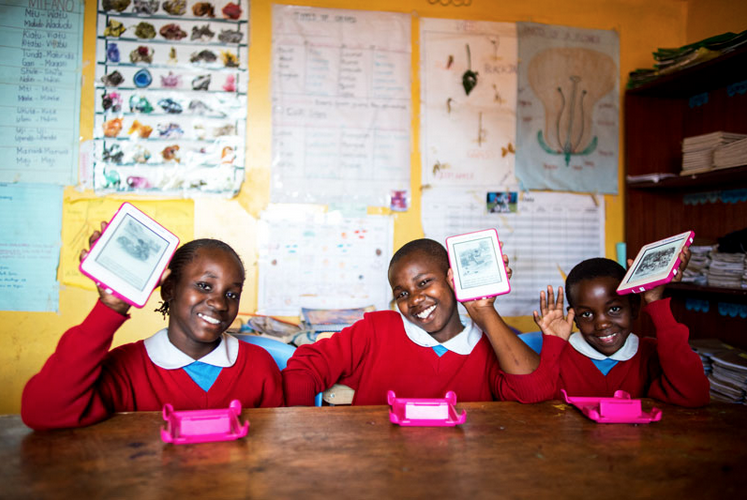 Big smiles from the girls at the Kibera School for Girls as they receive 5,000 life-changing e-books.