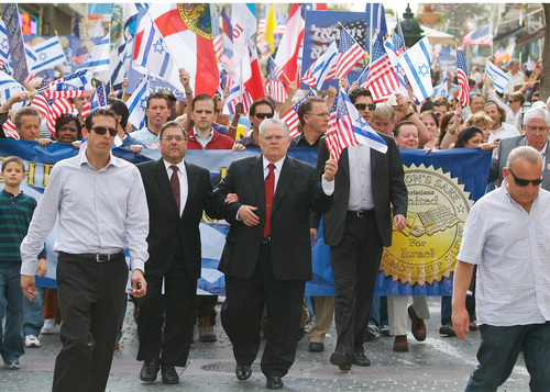 Click photo to download. Caption: A Christians United for Israel (CUFI)Â solidarity march in Jerusalem in 2010. In center in front the banner, holding American and Israeli flags, is CUFI founder Pastor John Hagee.Â Credit: CUFI.