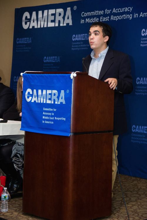 Click photo to download. Caption: Justin Hayet speaks at an event of the Committee for Accuracy in Middle East Reporting in America (CAMERA). Credit: CAMERA.