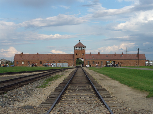 Click photo to download. Caption: The railway leading up to the main gate at the Nazis' former Auschwitz II (Birkenau) concentration camp. Credit: Michel Zacharz via Wikimedia Commons. 