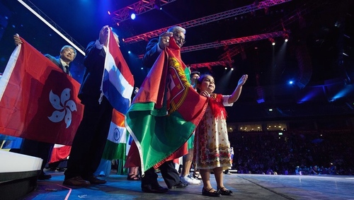 Click photo to download. Caption: International flags are showcased by delegates at this year's Feast of Tabernacles celebration in Jerusalem. Credit: ICEJ.