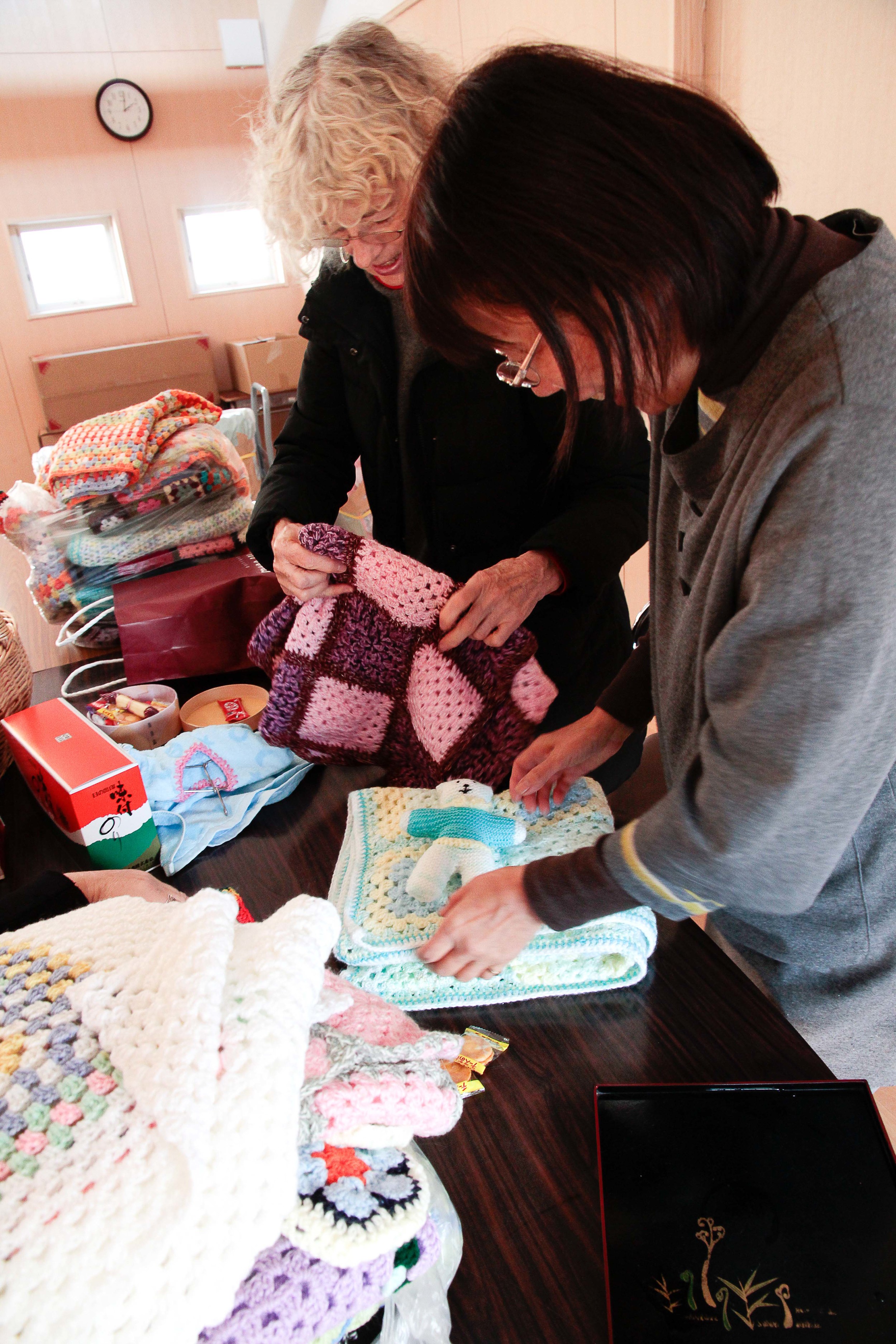 London's Kyoku-Kyoku share group made blankets with matching teddy bears. These will be given to new infants.