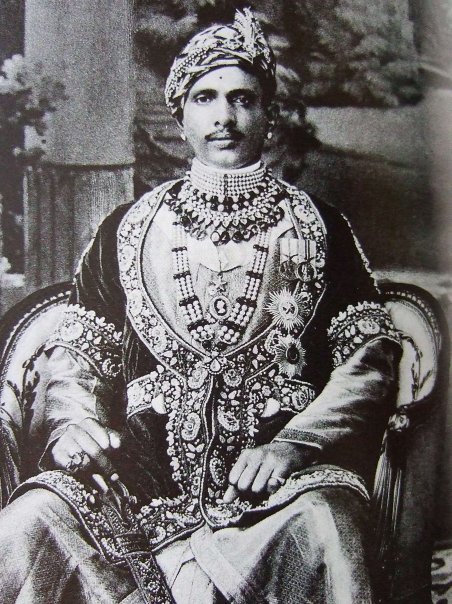 Maharaja Sawai Jai Singh Bahadur of Alwar, born 1882. Besides his traditional Indian ornaments, he wears the star insignia of the Indian orders granted to him by the British (Raj), then considered a part of the royal regalia.