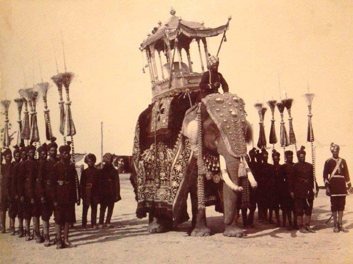 The state durbar decorated elephant, with attendants of the Maharaja of Mysore. Royal India.