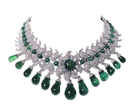 Van Cleef & Arpels, Paris, 1949–50. The "Baroda Set" ordered by the Maharani of Baroda, “The Indian Wallis Simpson”, wife of the Maharaja of Baroda. This impressive suite of jewellery was designed by Jacques Arpels for Sita Devi, the second wife of Maharaja Pratapsinh Gaekwad of Baroda. It consists of 13 pear-shaped Colombian emeralds – 154 carats in total – suspended from diamonds set in the shape of a lotus flower. All the gems were all supplied by the Maharani and belonged to the Baroda Crown Jewels.