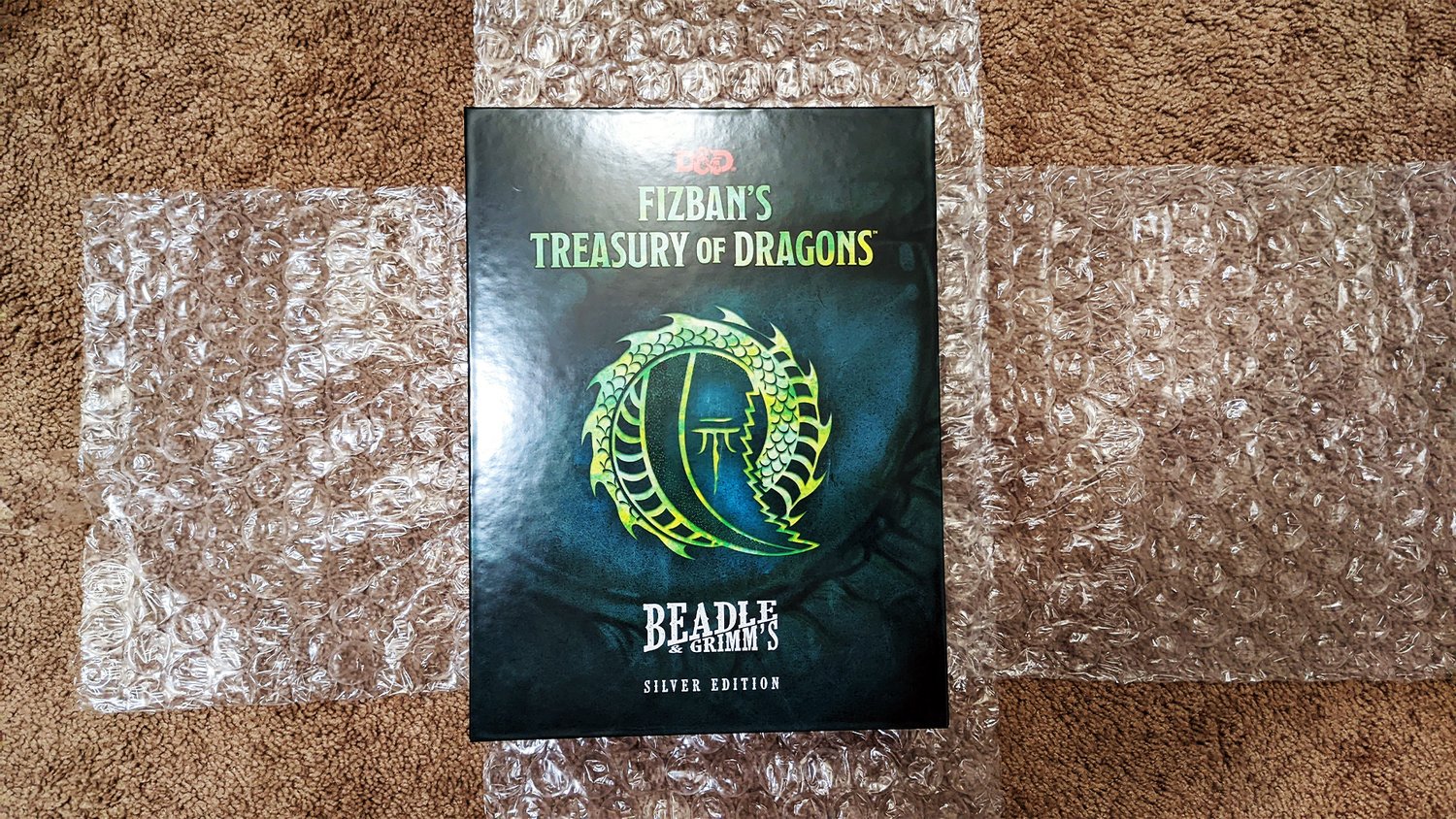 Check out the silver version of FIZBAN’S TREASURY OF DRAGONS for D&D from Beadle & Grimm’s – GeekTyrant