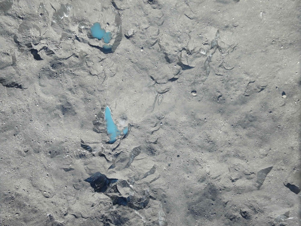 One of the 1,655 images of Tasman Glacier that we've taken from the Sky Hunter. The glacier is covered in debris, hence its gray color. Blue melt ponds are on the surface.