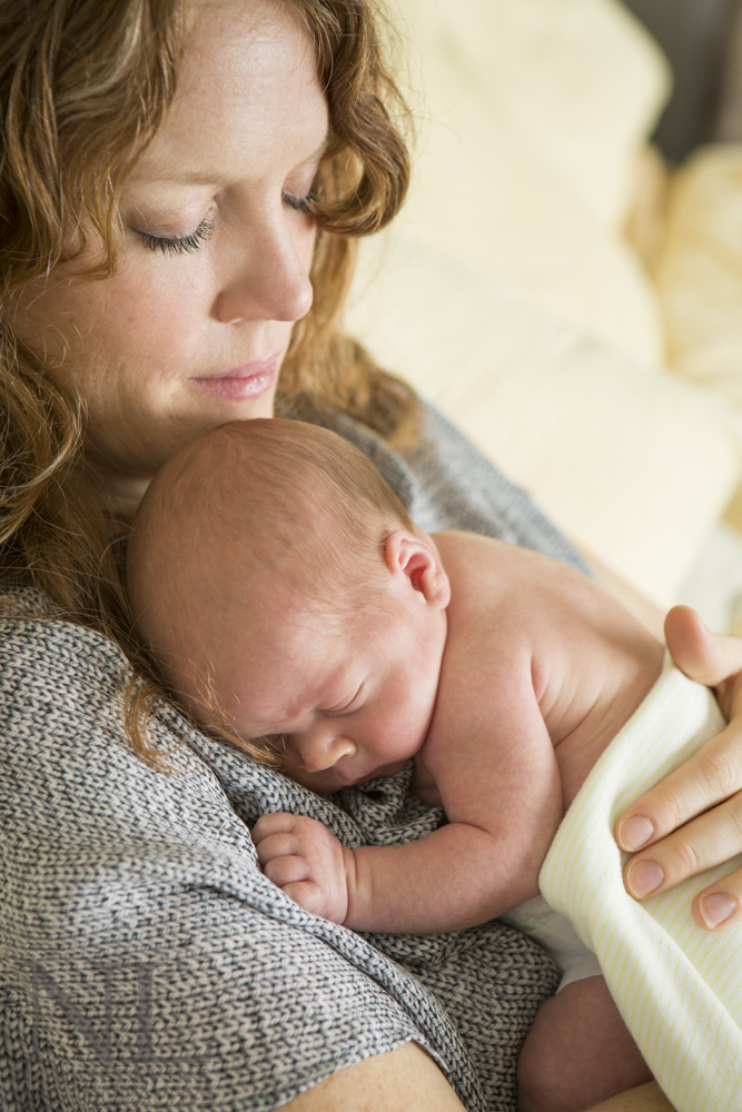 Newborn session by photographer Norah Levine who photographs pets children and families in Austin, TX.