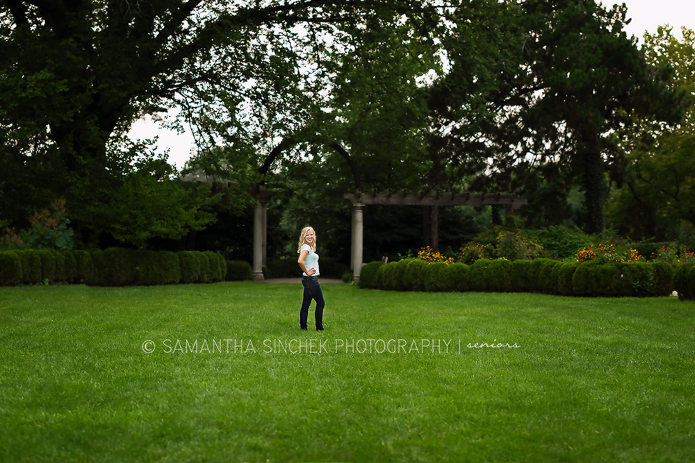 theresa stands in the grass at Ault Park, Cincinnati Ohio