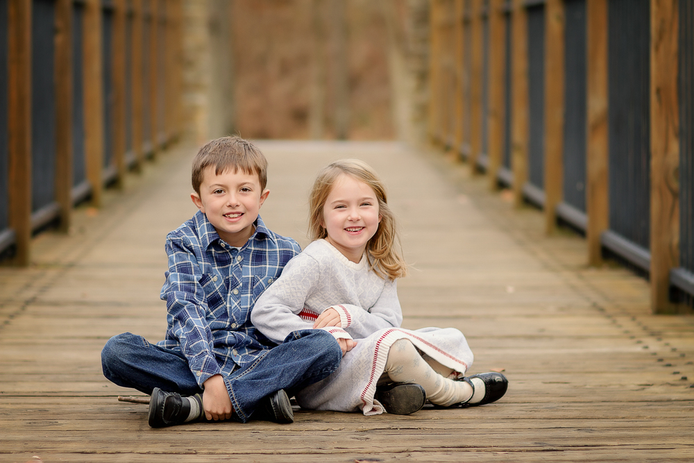 siblings smile during a photo session with Samantha Sinchek Photography