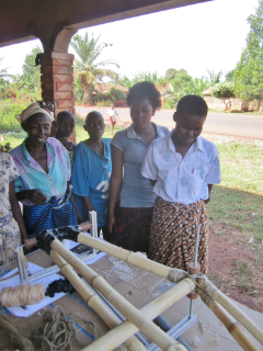 Village women observing the bike-building process