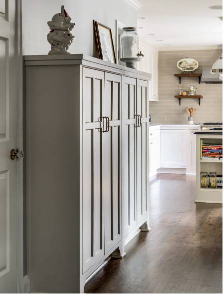 The grey painted cabinetry was designed to work as their pantry in the new kitchen.  