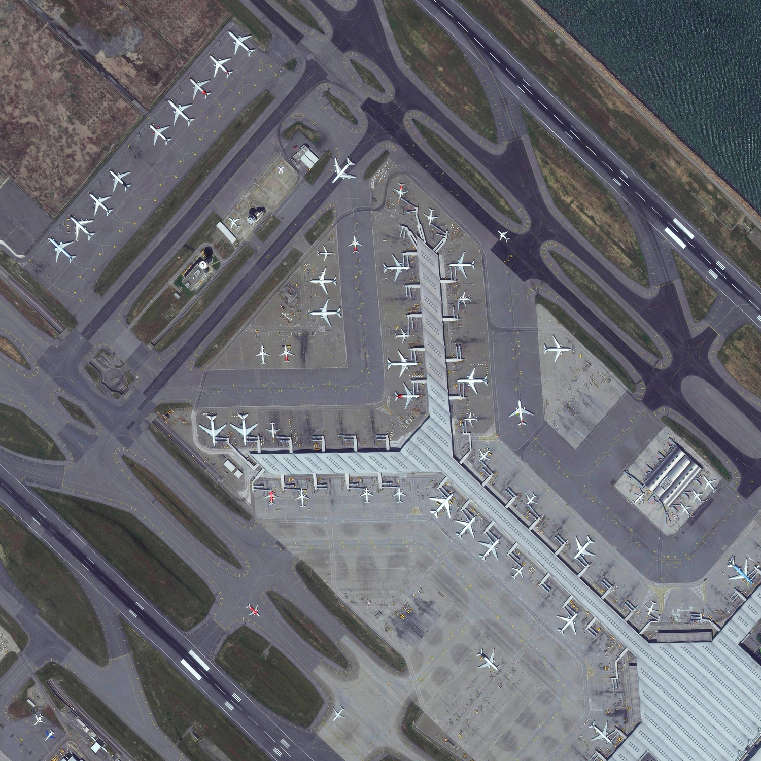   8/11/2015 Hong Kong International Airport Chek Lap Kok, Hong Kong 22°18′32″N 113°54′52″E   Tonight I’m headed off on a trip to China, via Hong Kong International Airport. The facility handles more than 63 million passengers each year. Terminal 1, seen here, is the third largest airport passenger building in the world, measuring more than 6 million square feet. I’ll do my best to post during my travels but apologies in advance if internet connection is spotty!