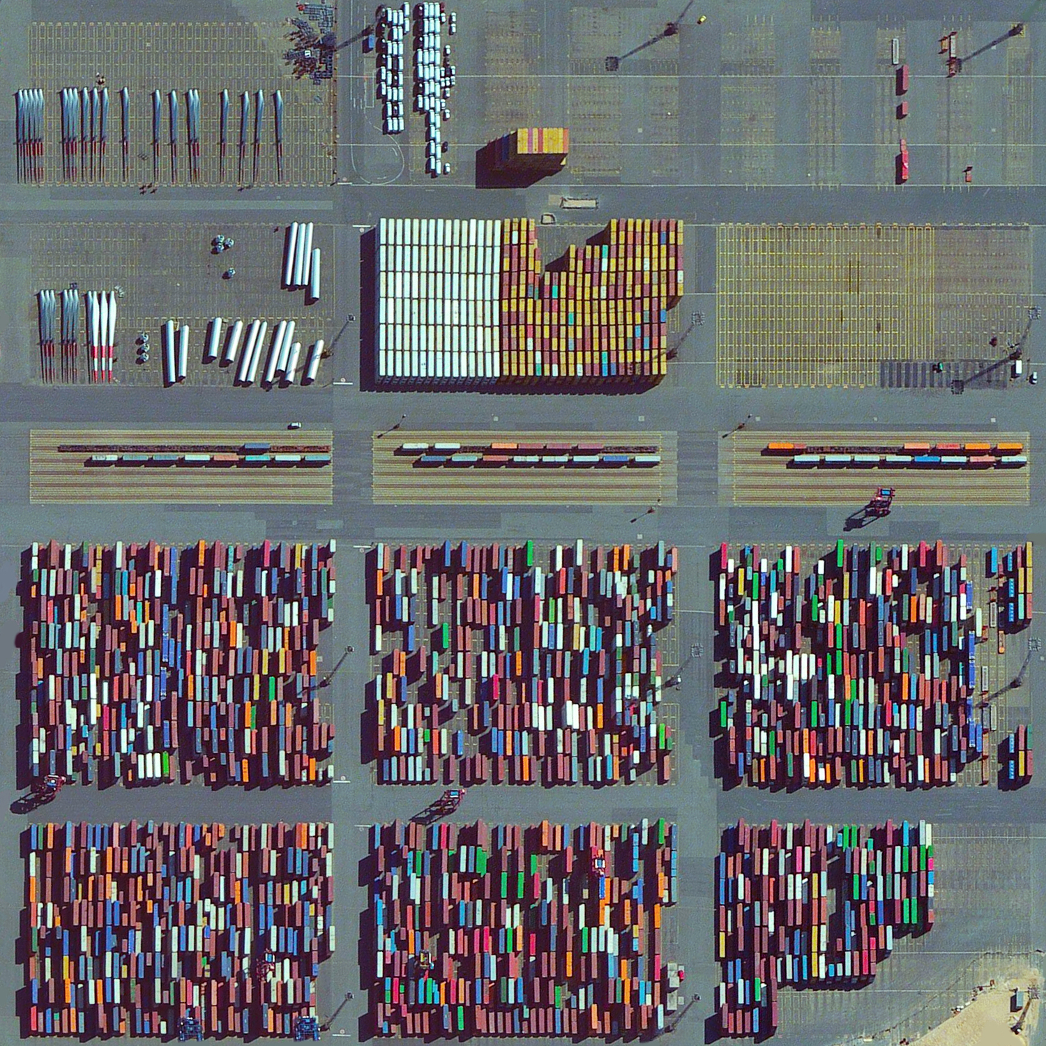   8/30/2015 Bremerhaven Port Bremen, Germany 53.584444960°, 8.536846512°   Thousands of items including shipping containers, wind turbine blades, and automobiles are prepared for transport at the Bremerhaven Port in Bremen, Germany. At any given moment, the port contains between 60,000 and 80,000 vehicles and it serves as the 23rd busiest port in the world with 5,831 thousand TEU's moved each year. With this post we’ll be signing off on vacation for the week and look forward to more posts when we get back!