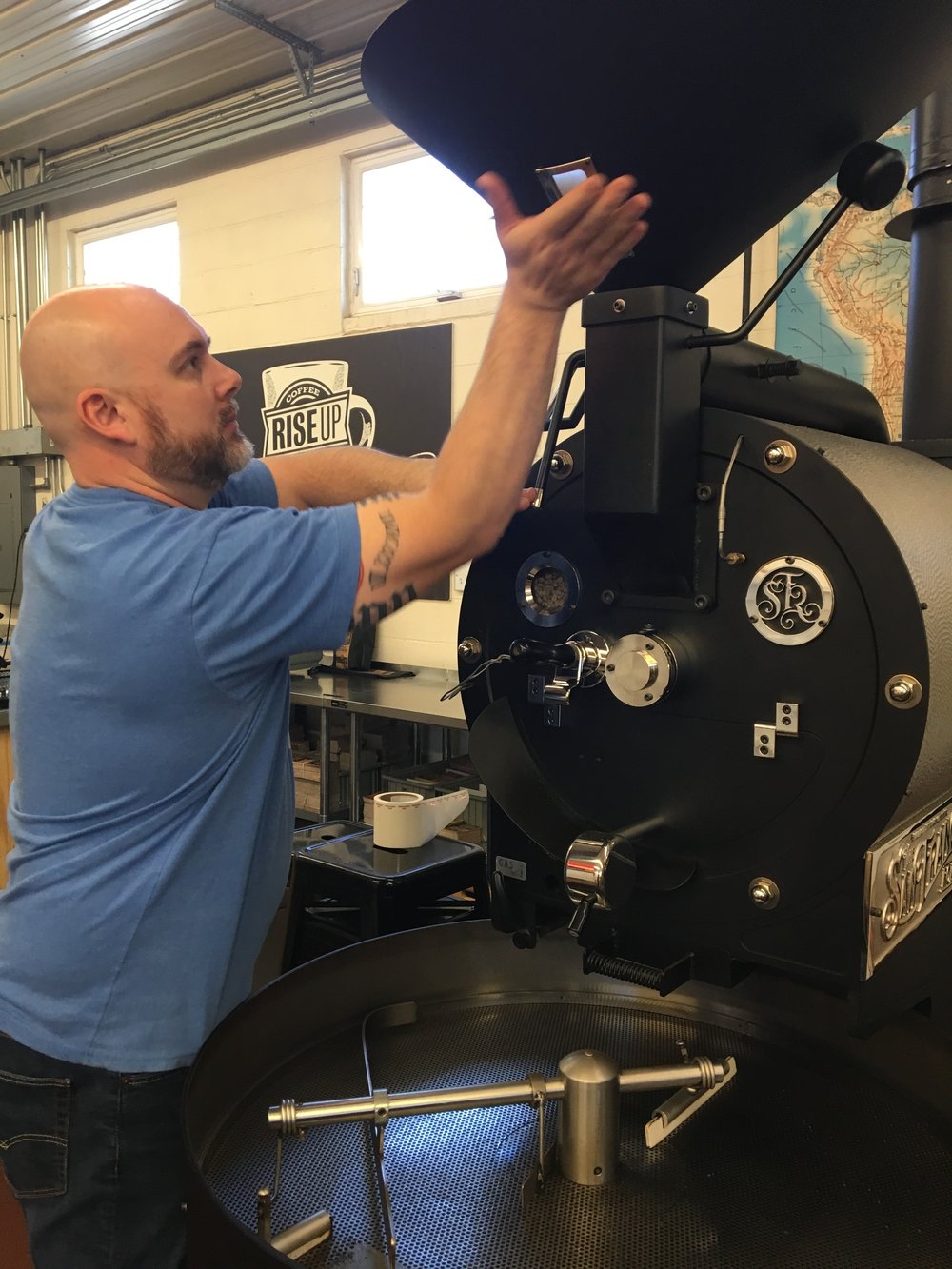 man working on industrial coffee machine