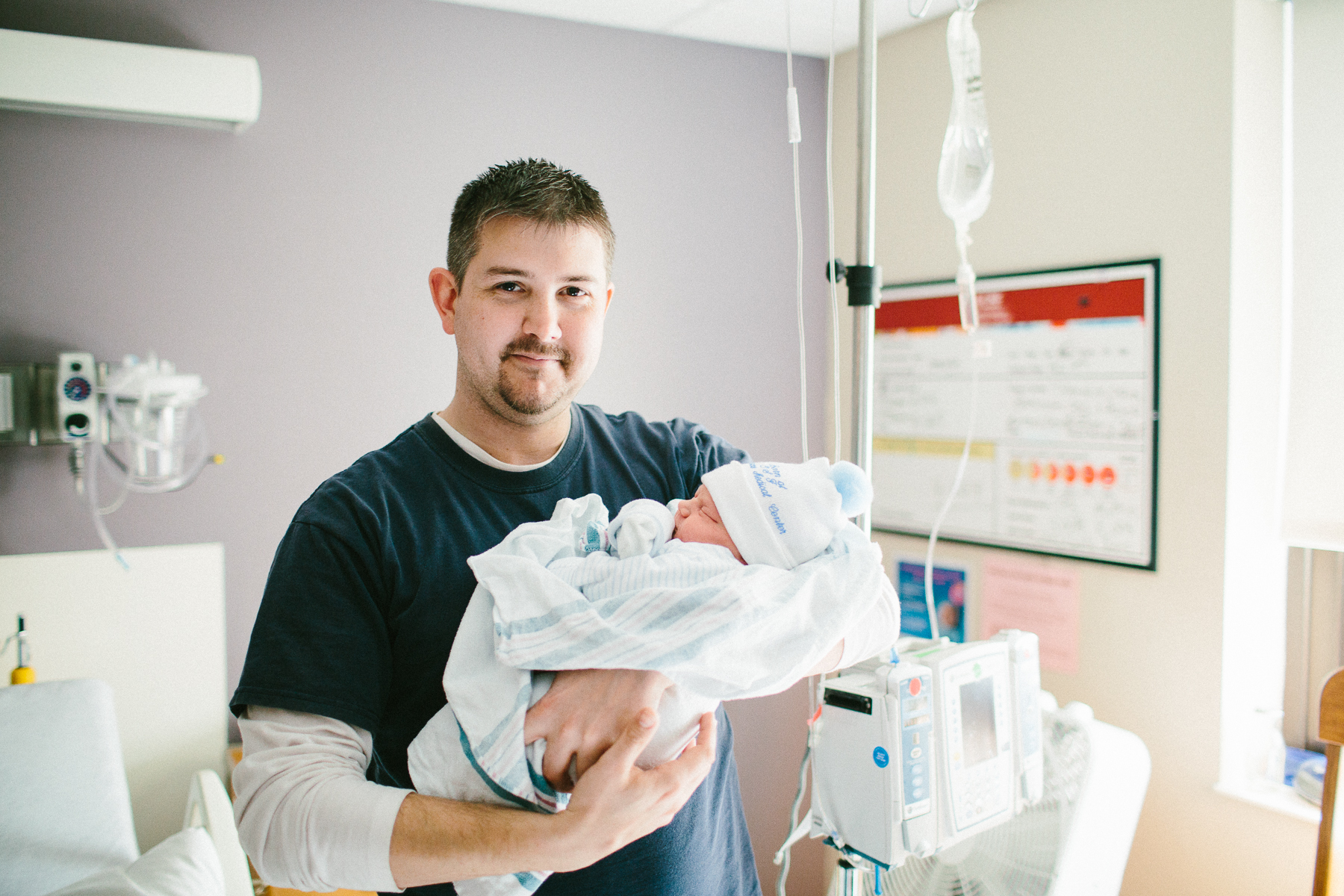 brother with newborn baby