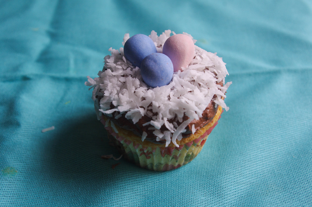 Almond Joy Cupcakes with Cadbury Mini Eggs Nest is the perfect dessert to celebrate Easter or the arrival of spring - www.thebatterthickens.com