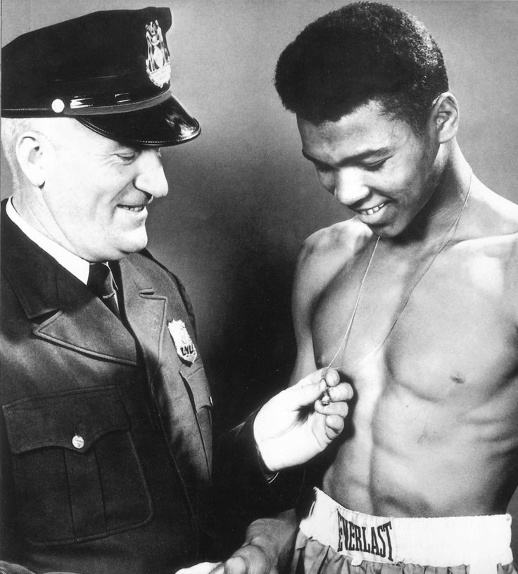 A young Cassius Marcellus Clay with Joe Elsby Martin the Louisville Kentucky police officer who taught him how to box.