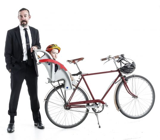 Dad bikes in a suit