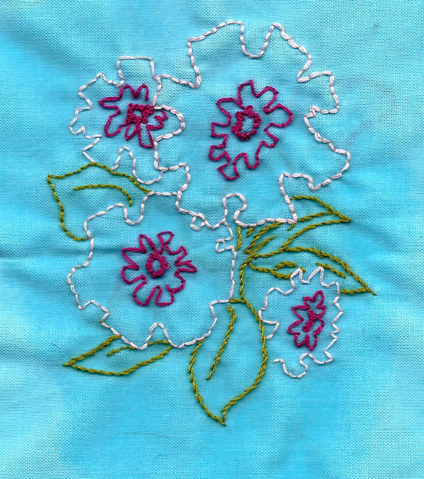 peach and magenta imaginary flowers. art by my gram. embroidery by me.