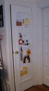 A door that has a custom bulletin board added to inset panel