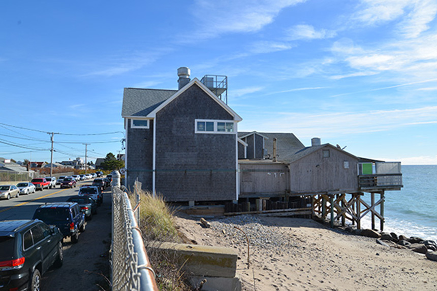 Homes and businesses, such as Ocean Mist, along a stretch of street in South Kingstown, R.I., are caught between an encroaching sea and Matunuck Beach Road. (ecoRI News)