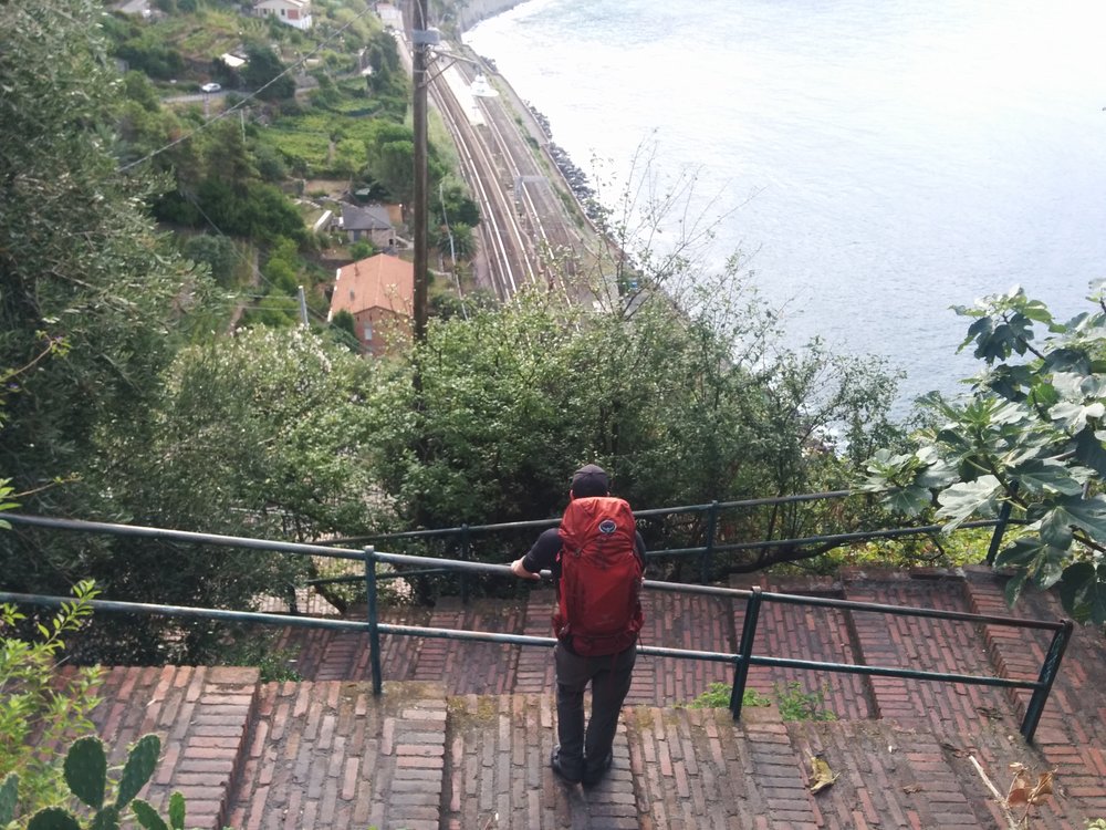  On the road again! Nick pausing to enjoy the view as we climb down the 400 stairs on our way to  Naples. 