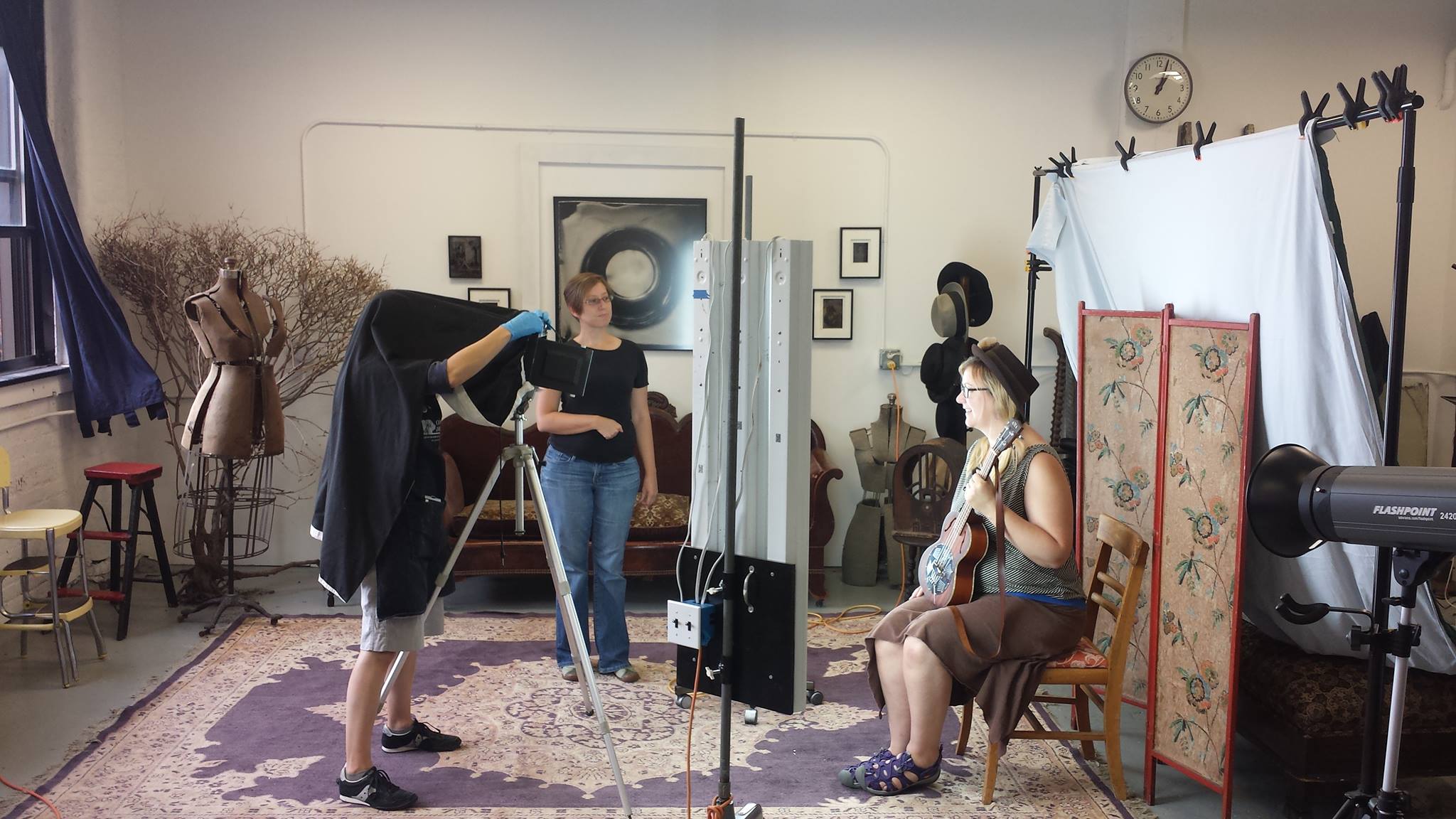 Jenn Libby making a tintype portrait in her studio, Genesee Libby Photography.