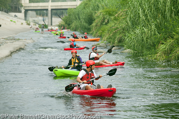 The small flotilla of kayaks heads down the first straightway, learning to control their craft and getting ready for the first rapids of the day.