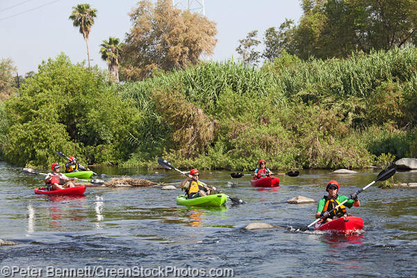 The boaters hit some open water as they get ready to traverse a series of small rapids.