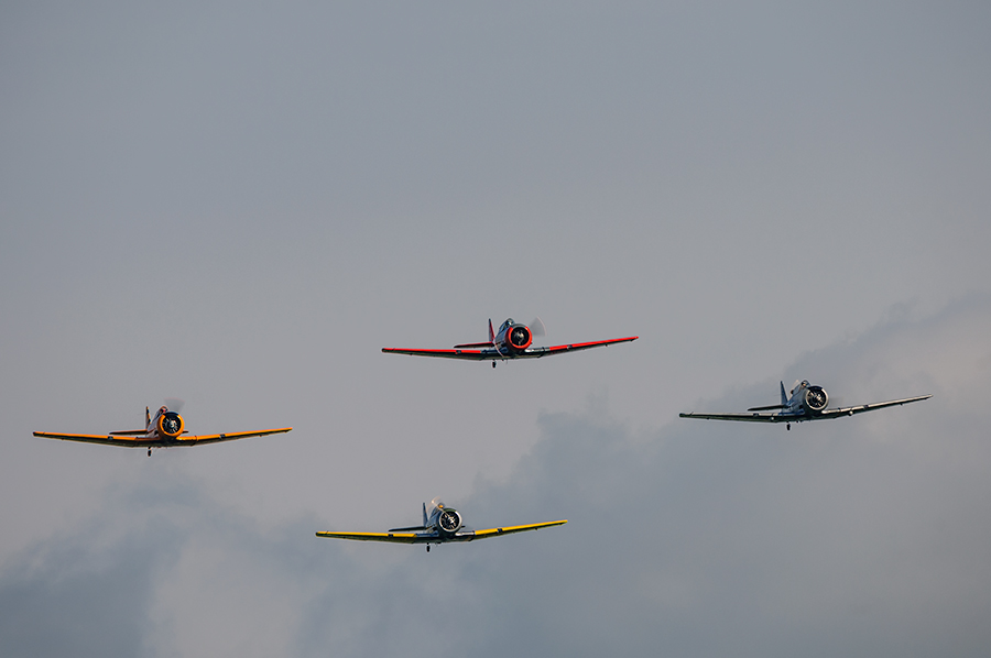 A formation of T6’s approaching the Dubuque Airport