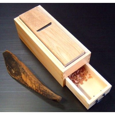  A piece of katsuobushi and the tool to cut the flakes (katsuobusi kezuriki-鰹節削り器)  