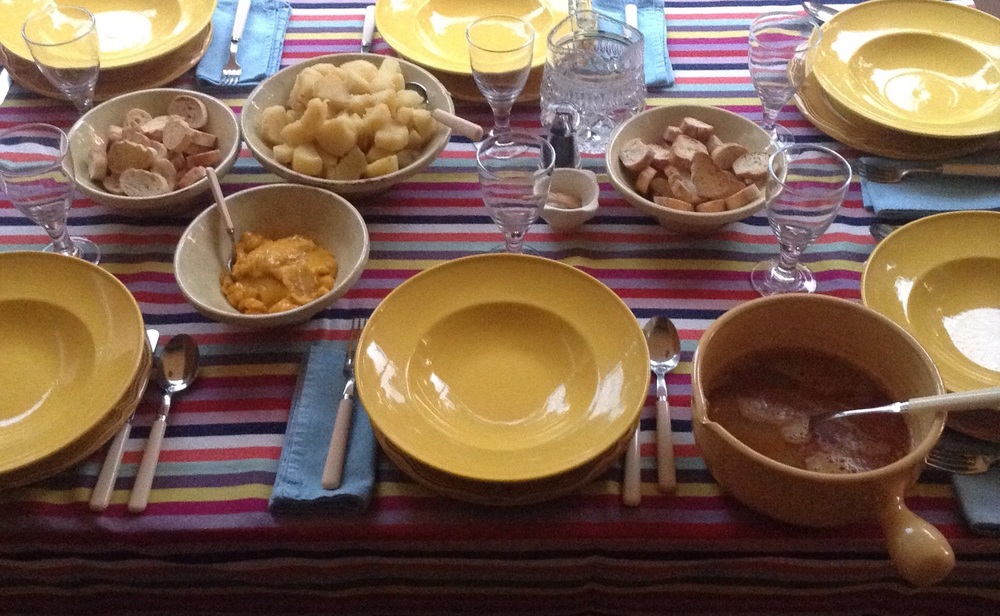  Bouillabaisse family table with croutons, saffron potatoes croutons again, fish soup and rouille 