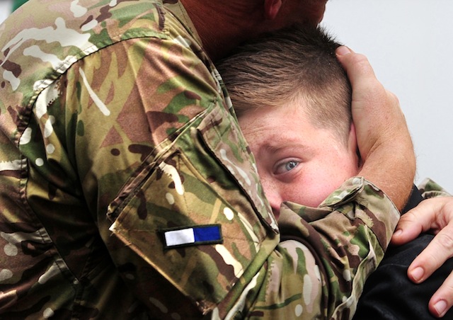 CO Vaudin of 2 Signal Regiment embraces his son, Nicholas, 12,  on his return from Afghanistan. Anthony Chappel-Ross © The Press, York