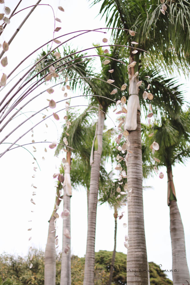 shells hanging from palm trees, what fun decor.