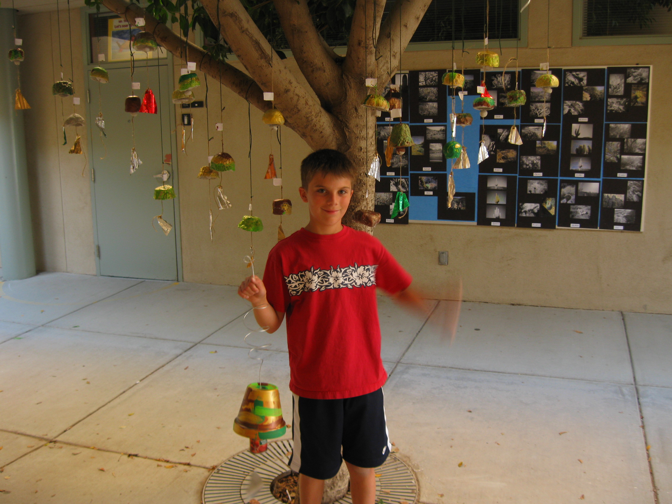 my son with our class's Paolo Soleri windbells 