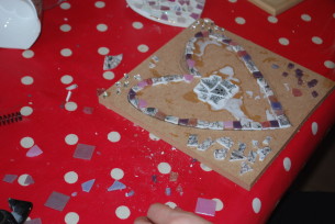 Rebecca starts by mosaicing the edge of the heart