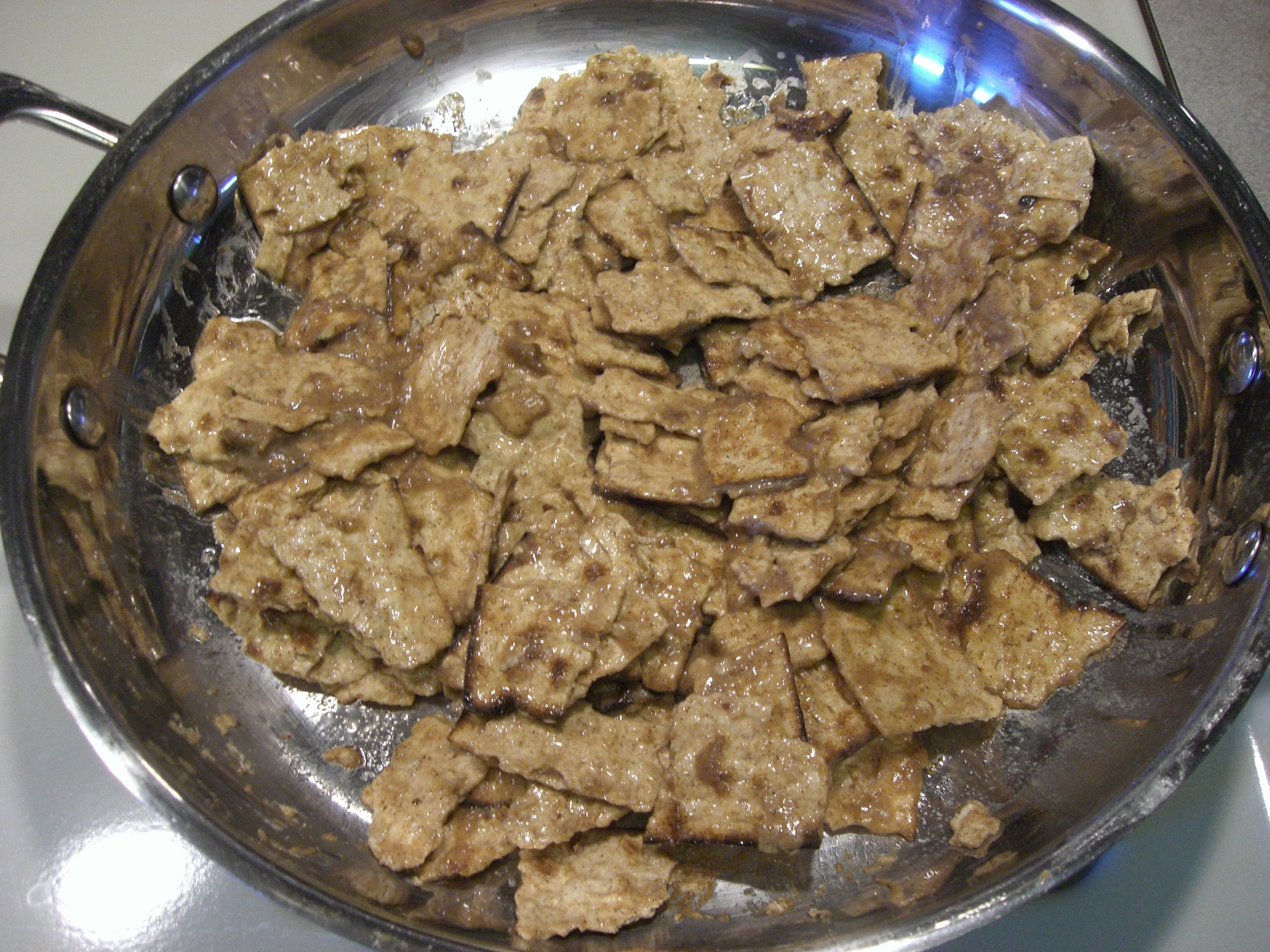 Vegan matza brei sizzling in the pan.