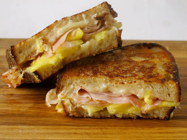 Grilled cheese social's sandwich with pineapple, rosemary ham, comte and cultured butter