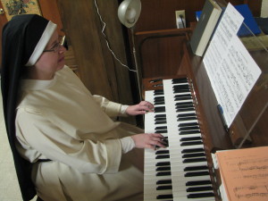Sr. Mary Cecilia practices the organ in our basement rec room.