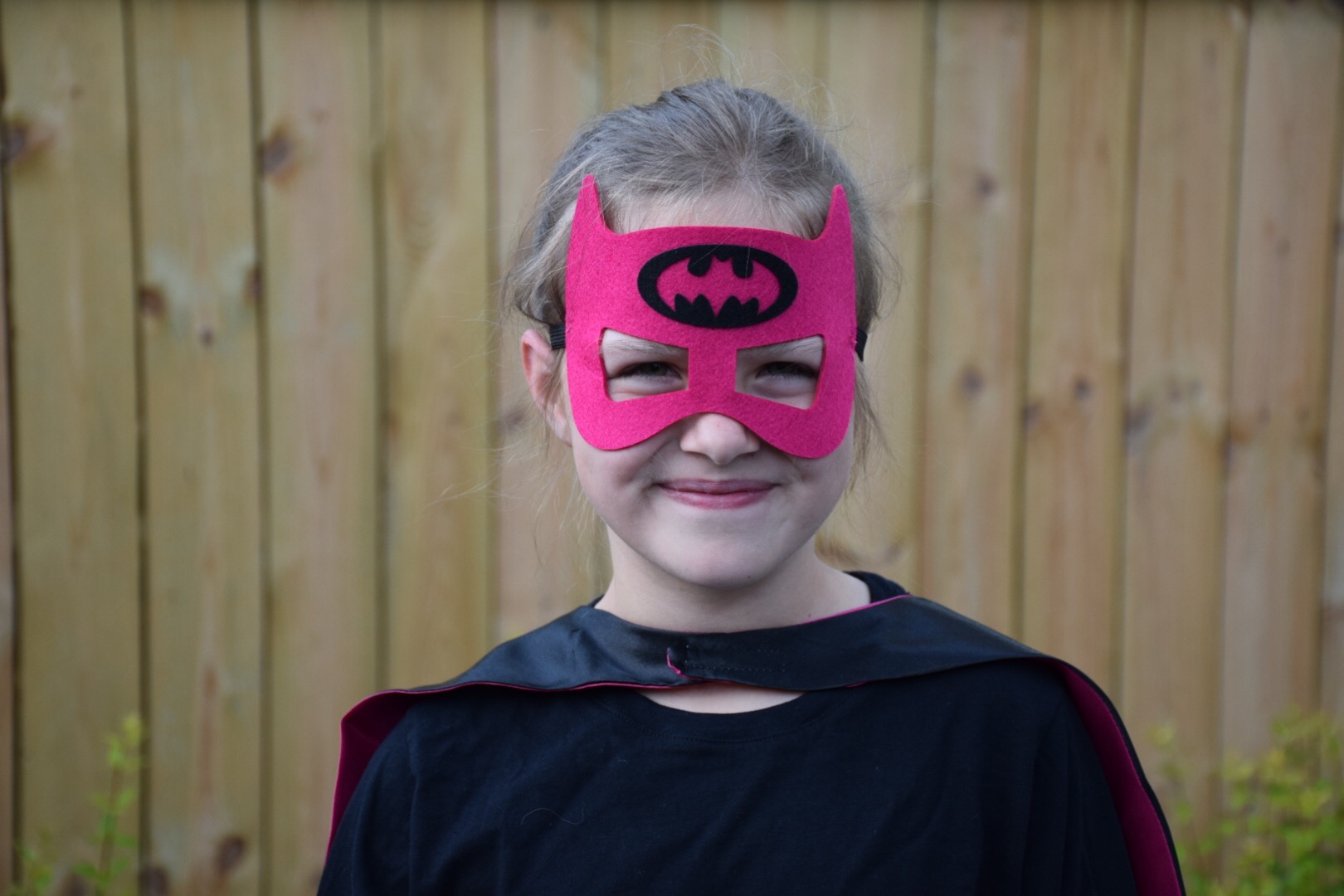 photo by emily reeves dean of her step-daughter wearing a batgirl mask